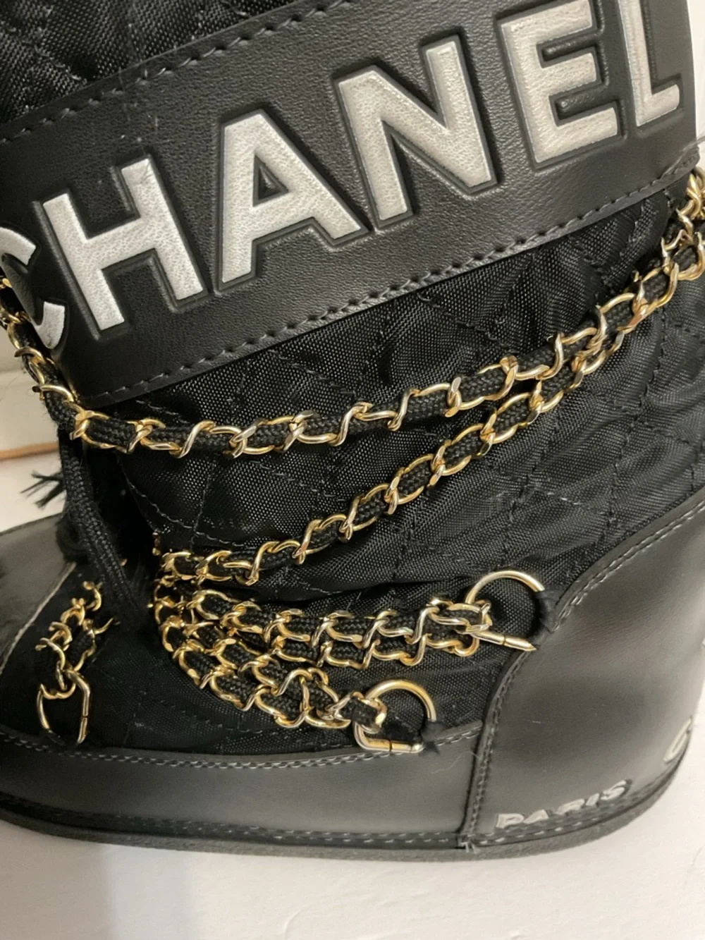 CHANEL Black and Gold Quilted Winter Lace-Up Boots